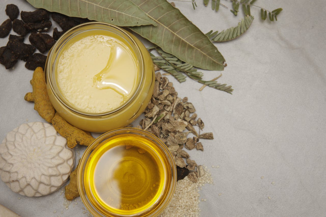 Flat lay of natural ingredients, herbs, and honey jars showcasing a healthy lifestyle and wellness theme.